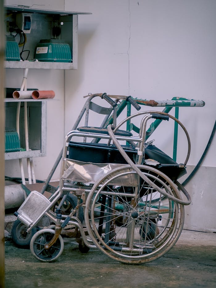 Old wheelchair in a rustic industrial environment, Central Visayas, Philippines.